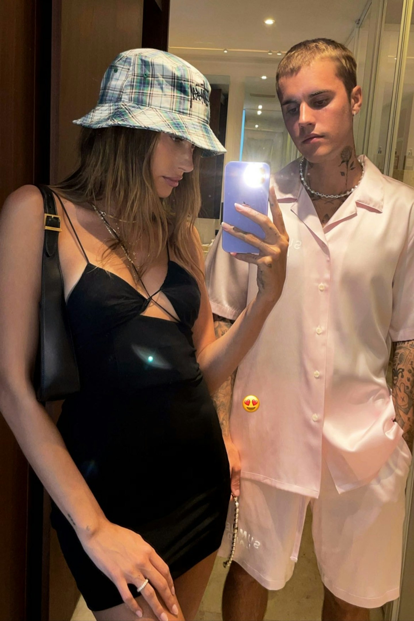 Hailey Bieber taking a selfie of her and Justin Bieber