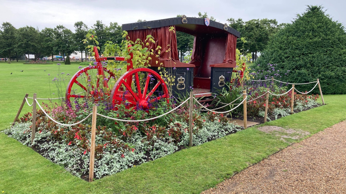 Carriage decorated with flowers outside Hampton Court Palace