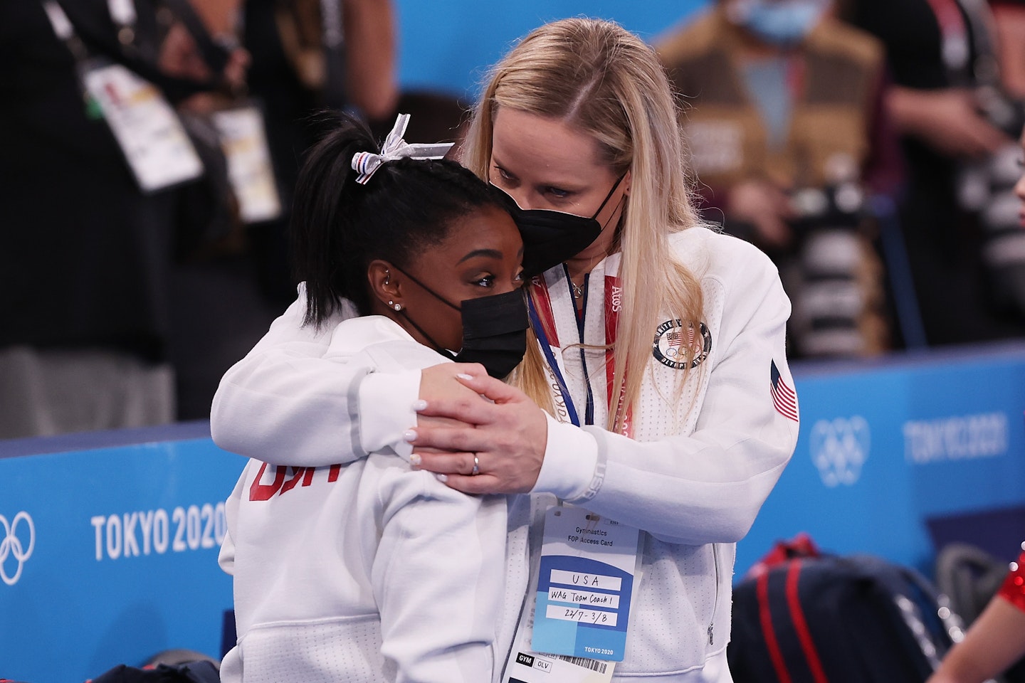 Simone Biles is hugged by coach Cecile Landi during the Women's Team Final on day four of the Tokyo 2020 Olympic Games