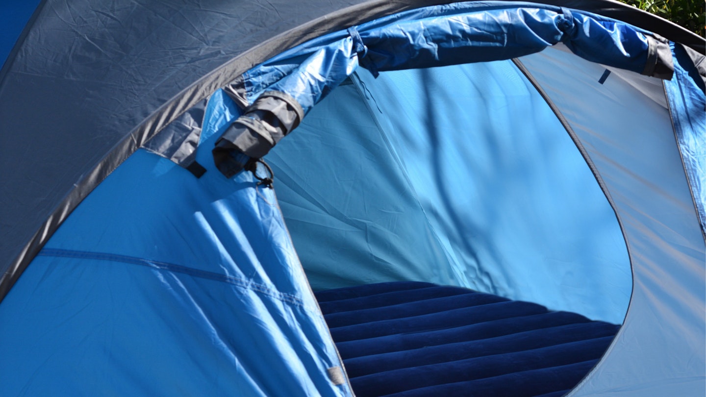 A photo of an airbed in a tent