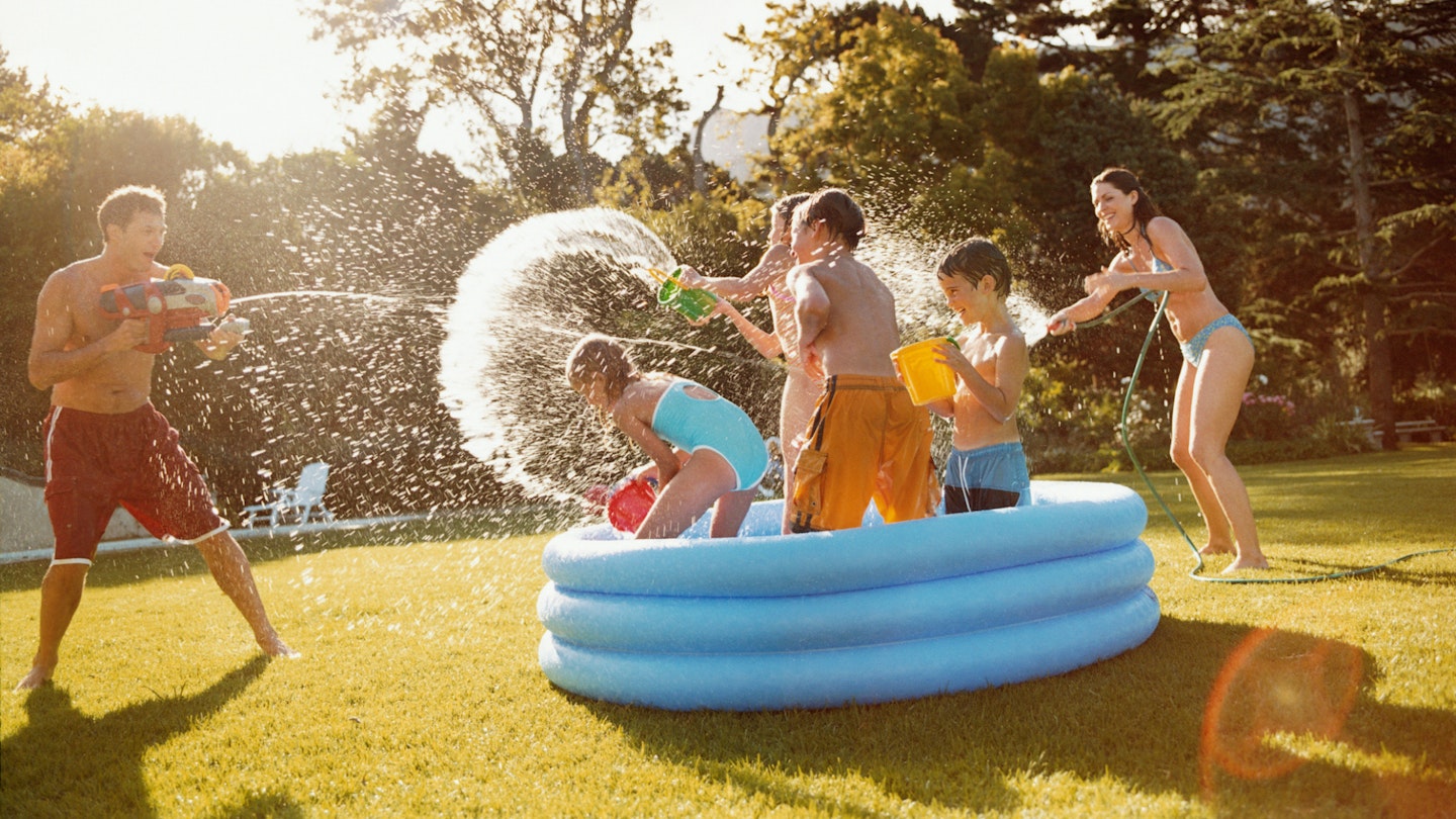 Paddling pool adults and children water fight