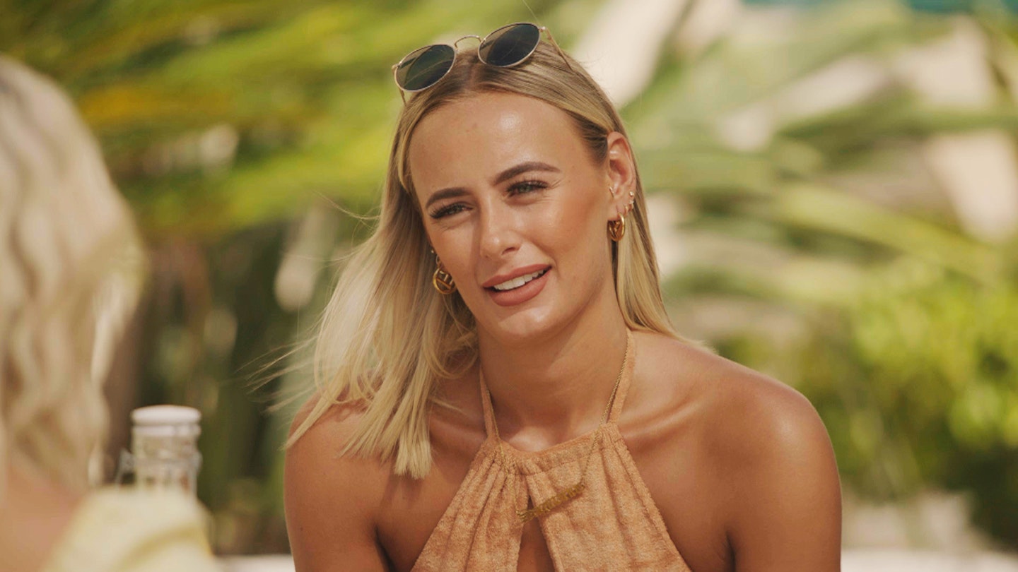 Millie Court wearing a towelling halter neck top