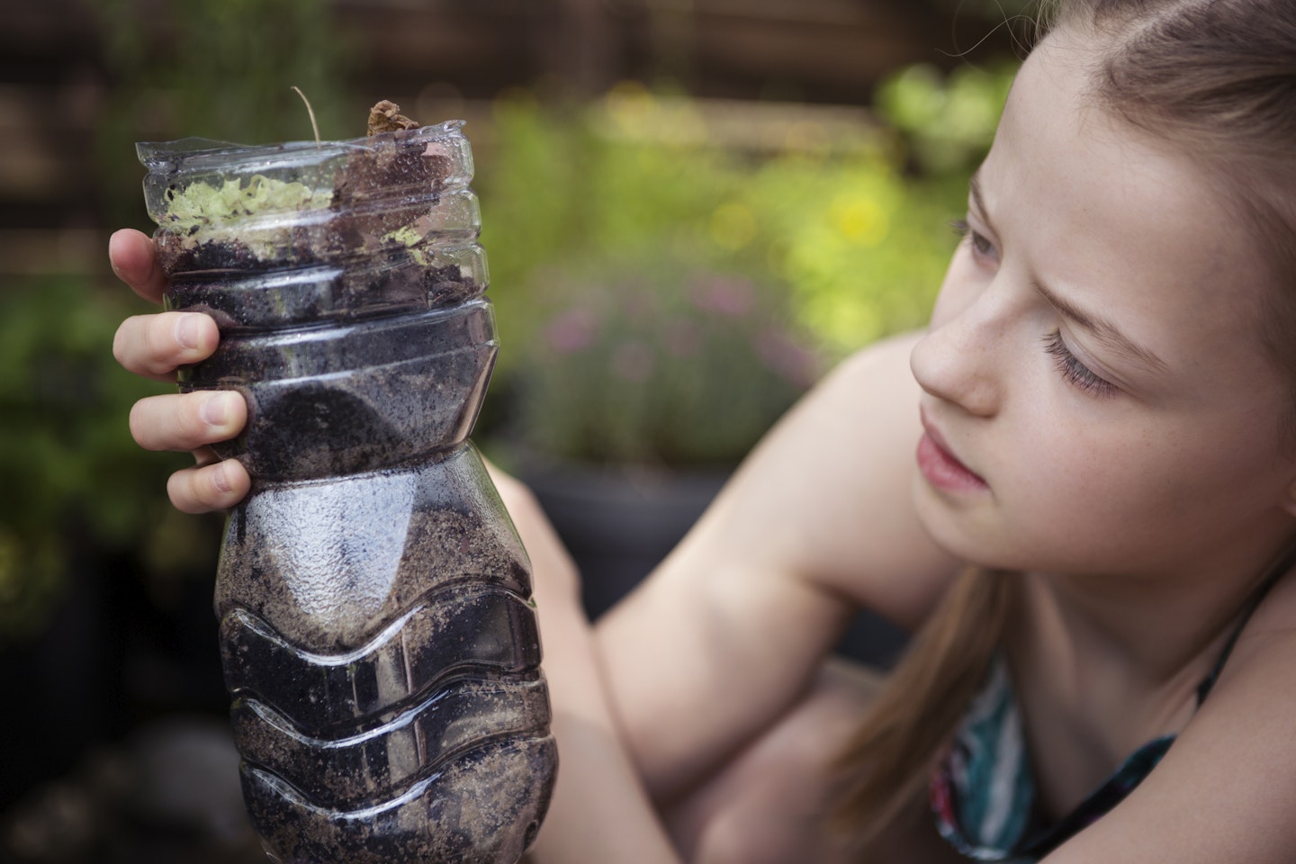 Child making wormery