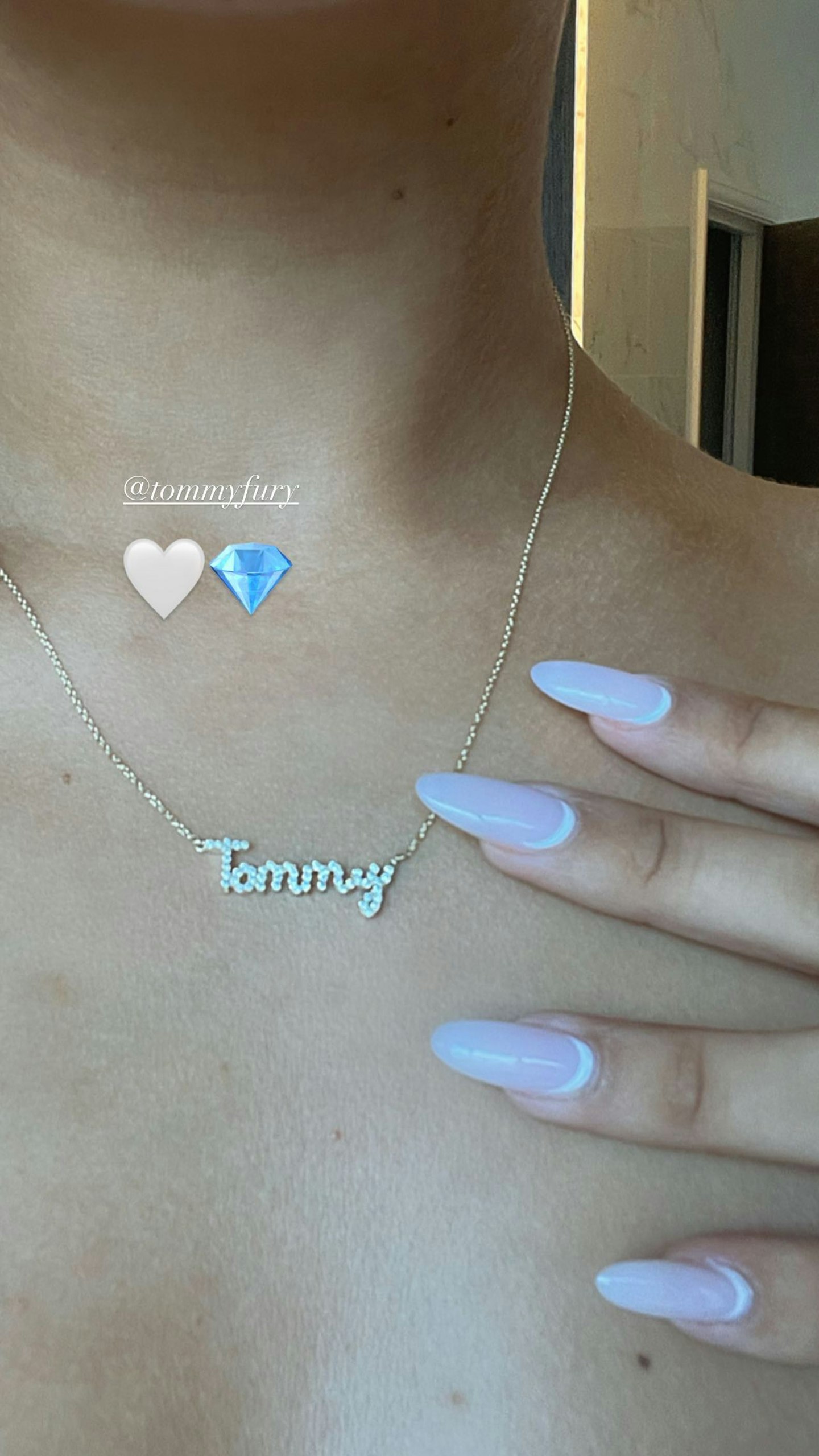 Molly Mae shows off her new 'Tommy' necklace