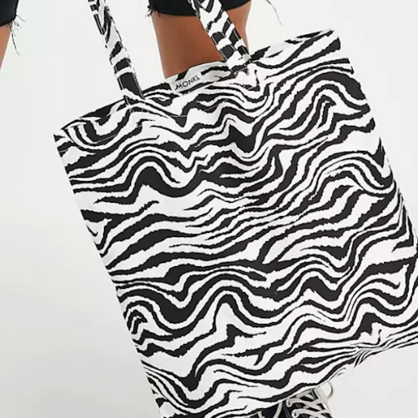 Zebra print tote bag on white background