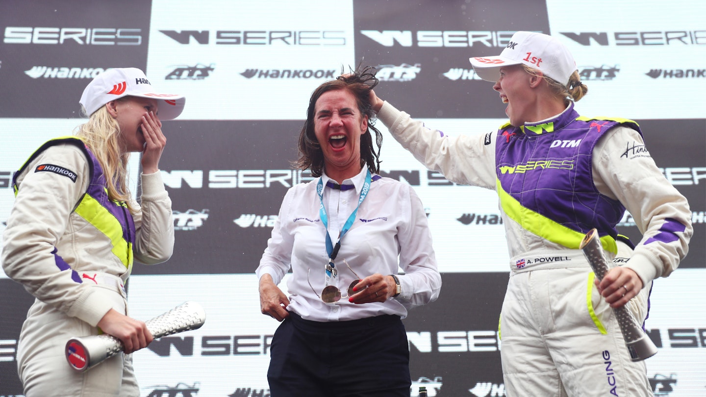 Catherine Bond Muir and two racers on the W Series podium