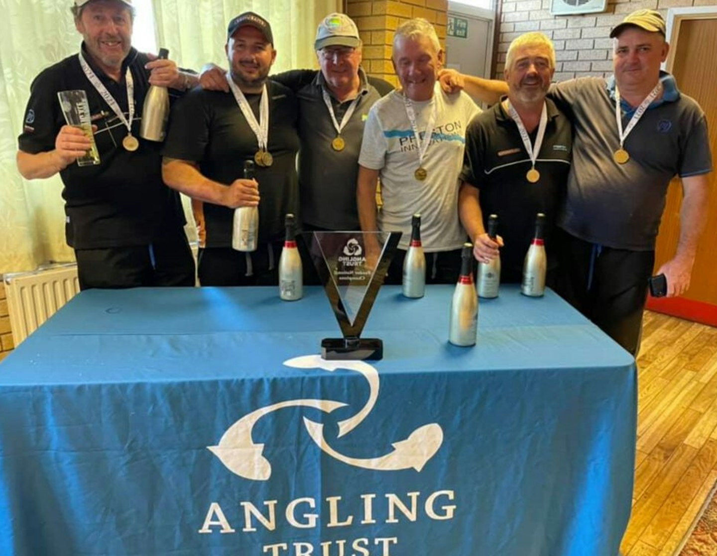The Preston Innovations Thatchers team celebrate after winning the Angling Trust Feeder National on the Gloucester Canal