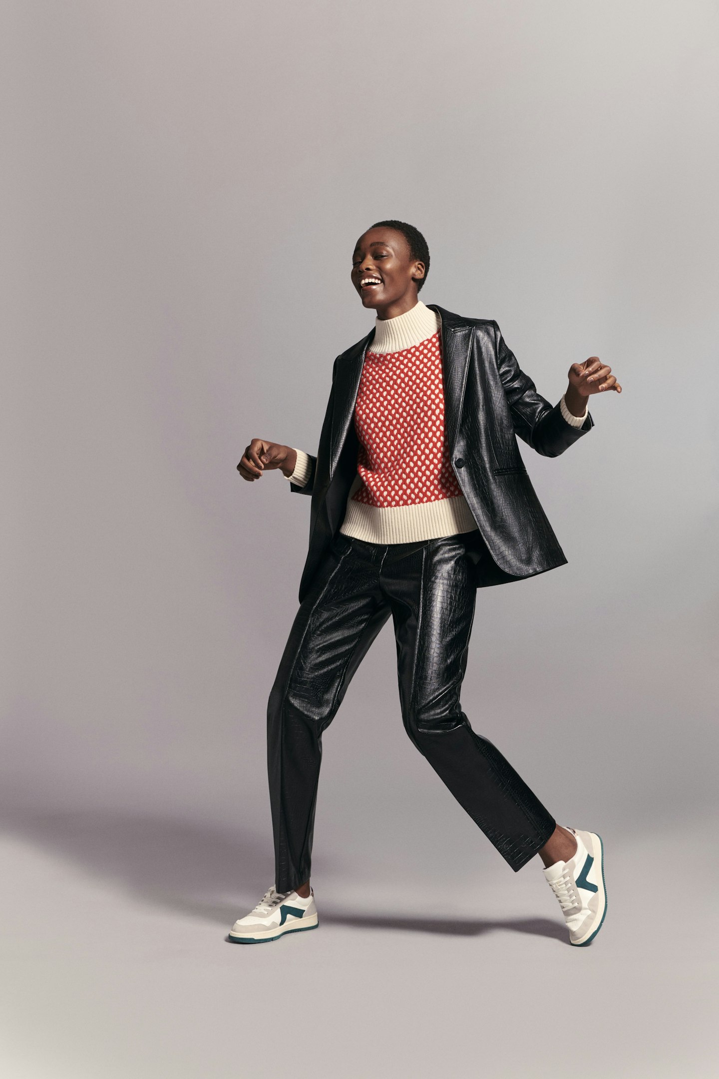 A model wearing a leather-look trouser suit