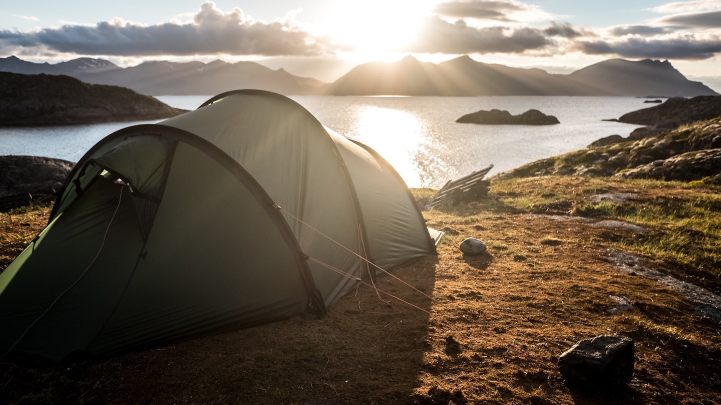 Tent pitched overlooking lake and mountains - best backpacking tents