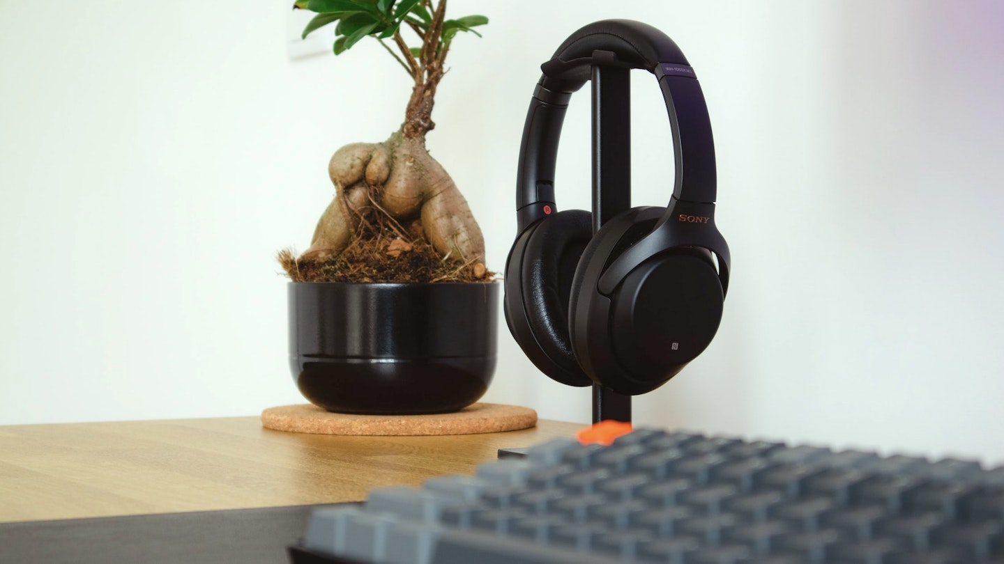 Sony headphones hanging on a headphone stand
