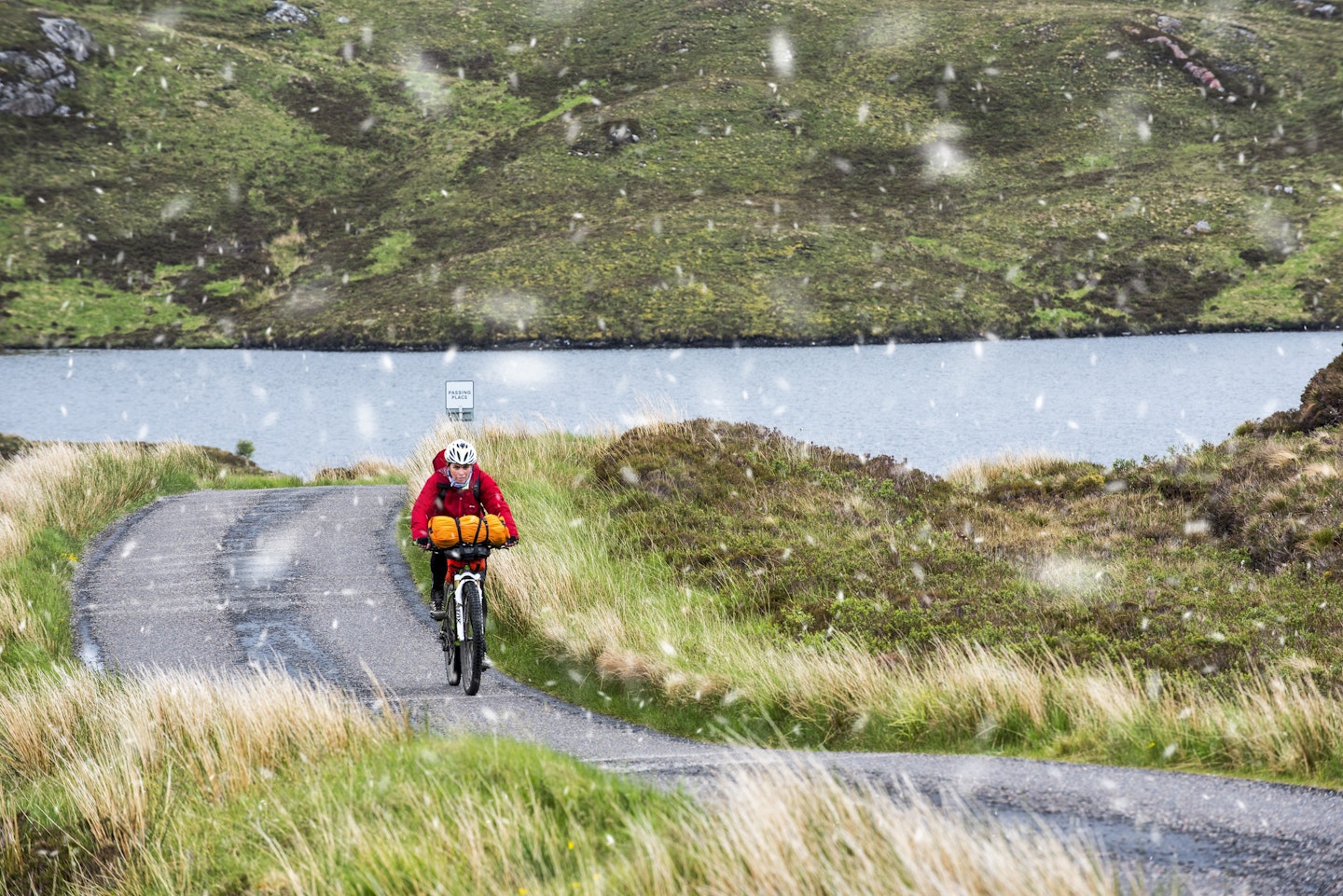 Woman biking in the snow