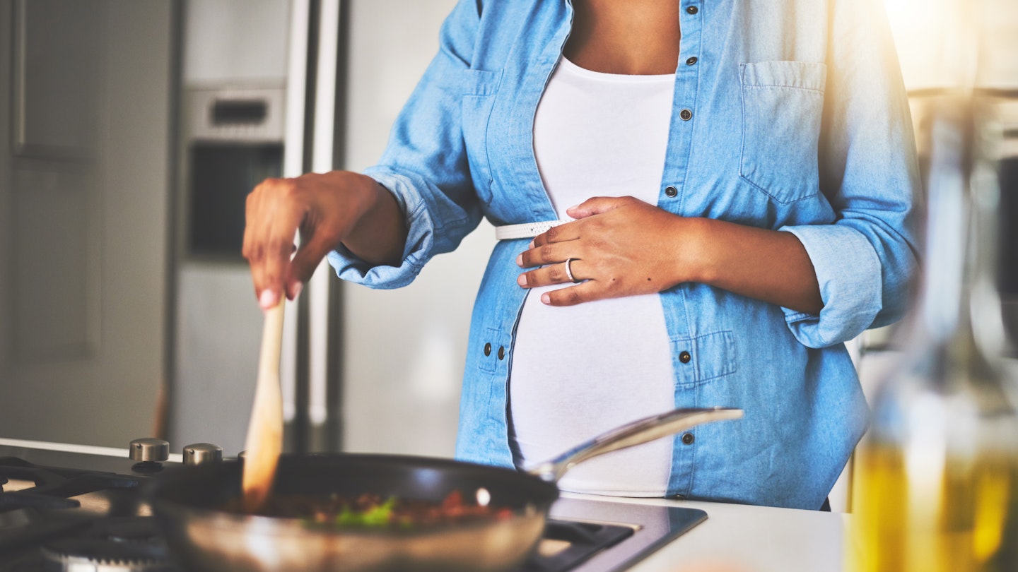 Pregnant Woman Cooking