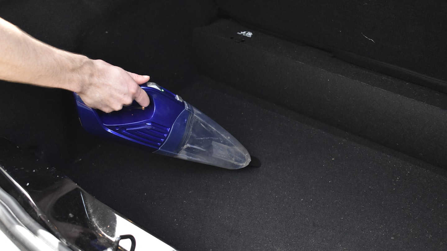 Vacuuming the boot of a car with the Beldray