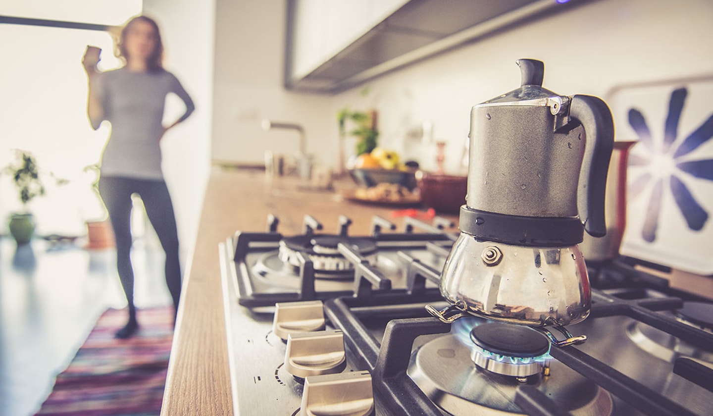 woman looking at cooker