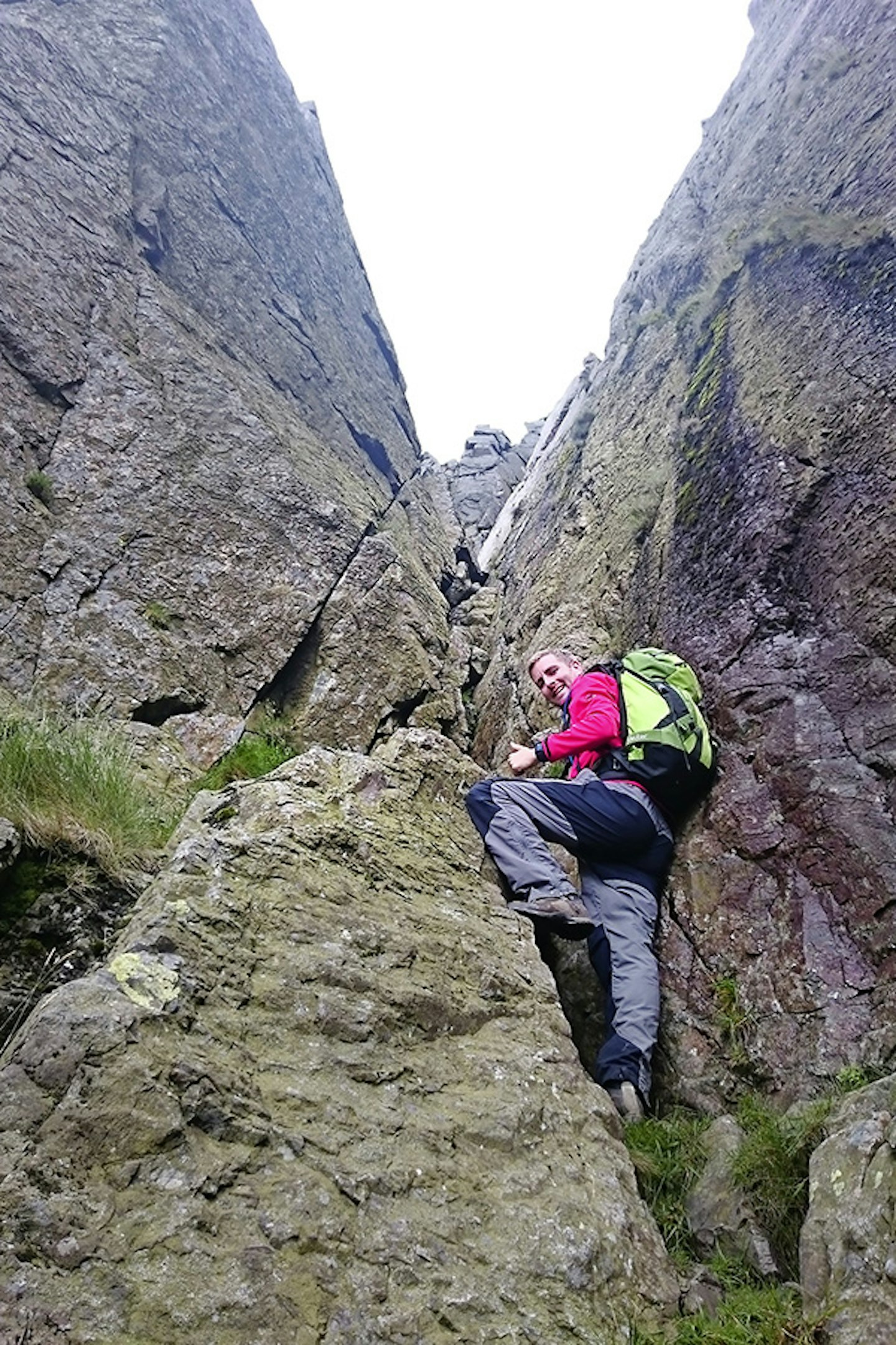 Ascending the steep V-shaped chimney on the eastern side of Needle Gap