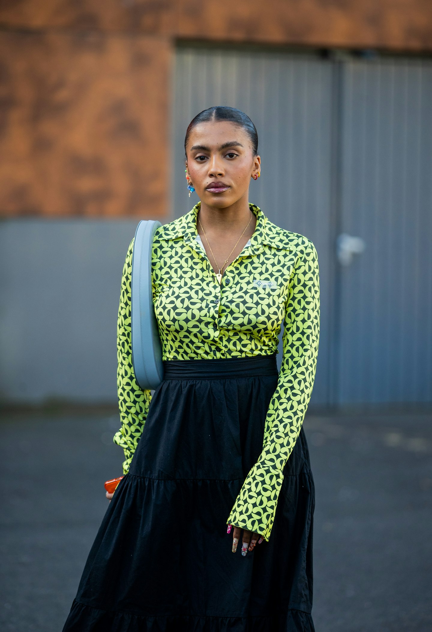 Marie-Victoire Tiangue's lime green button-down was a breath of fresh air outside Coperni