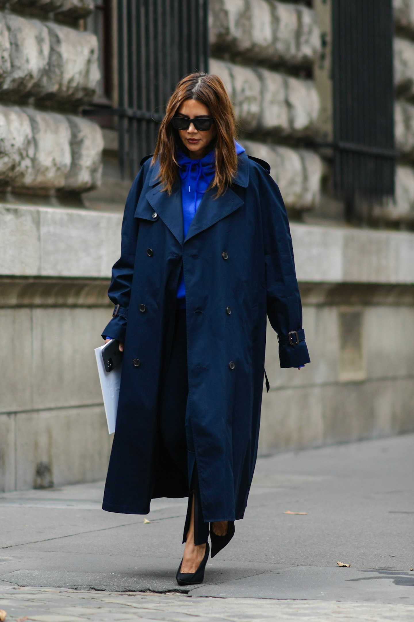 Christine Centenera's lo-fi hoodie and trench combo was a hit outside Loewe