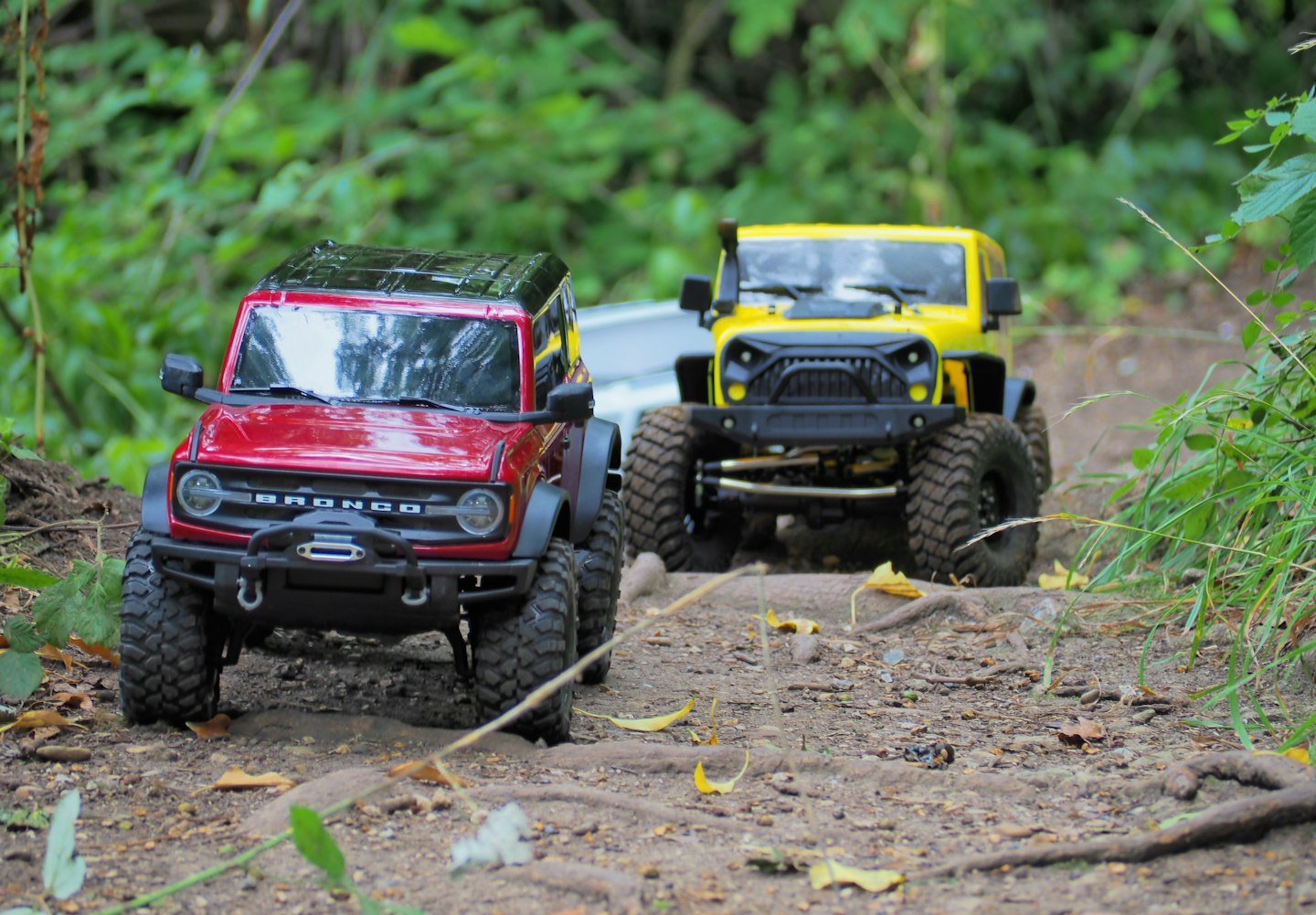 Traxxas Bronco leading a convoy of vehicles