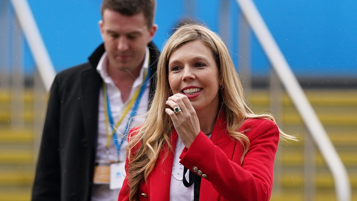 Carrie Johnson wearing a red blazer