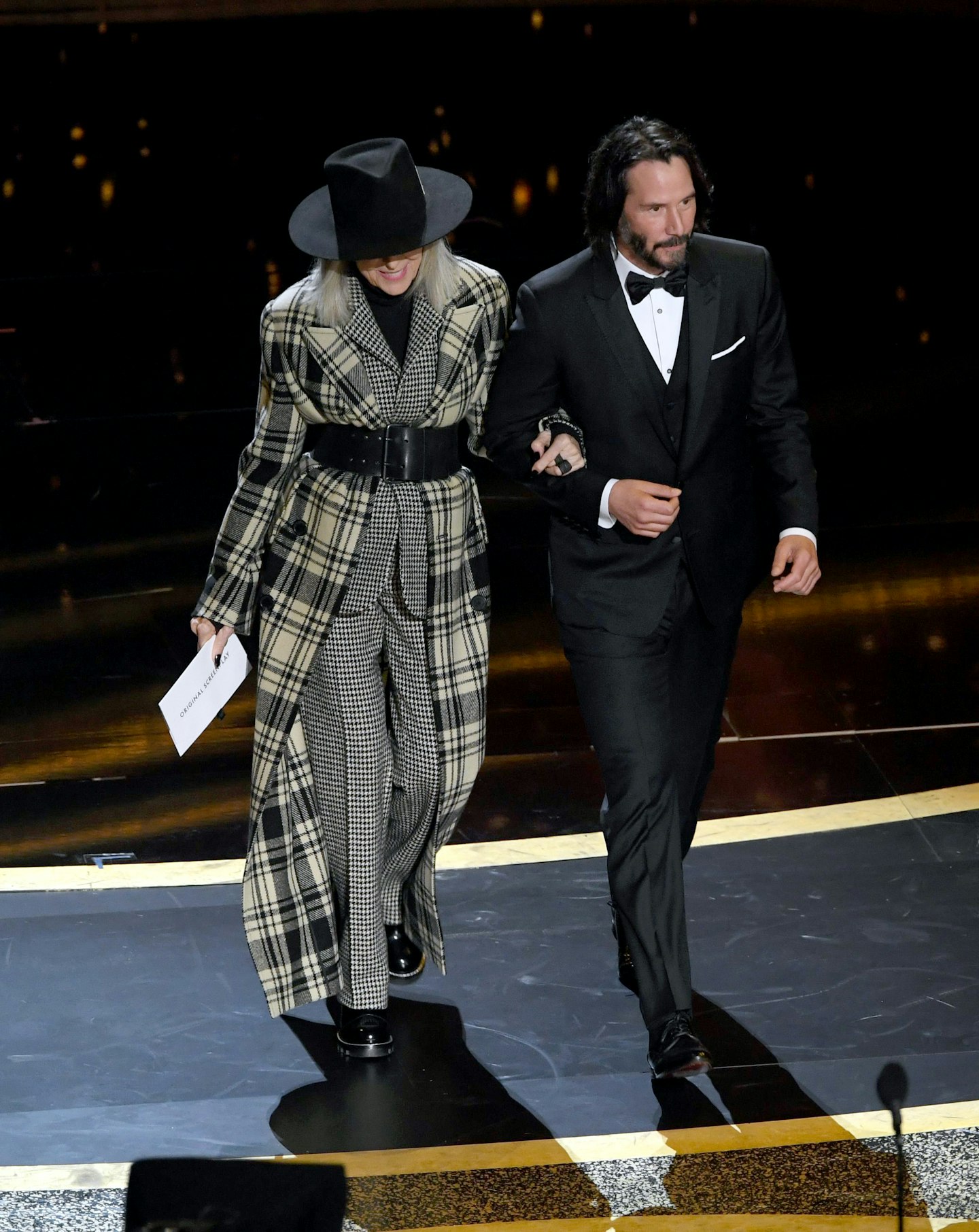 A checked and just-the-right-length coat, expertly paired with Keanu Reeves