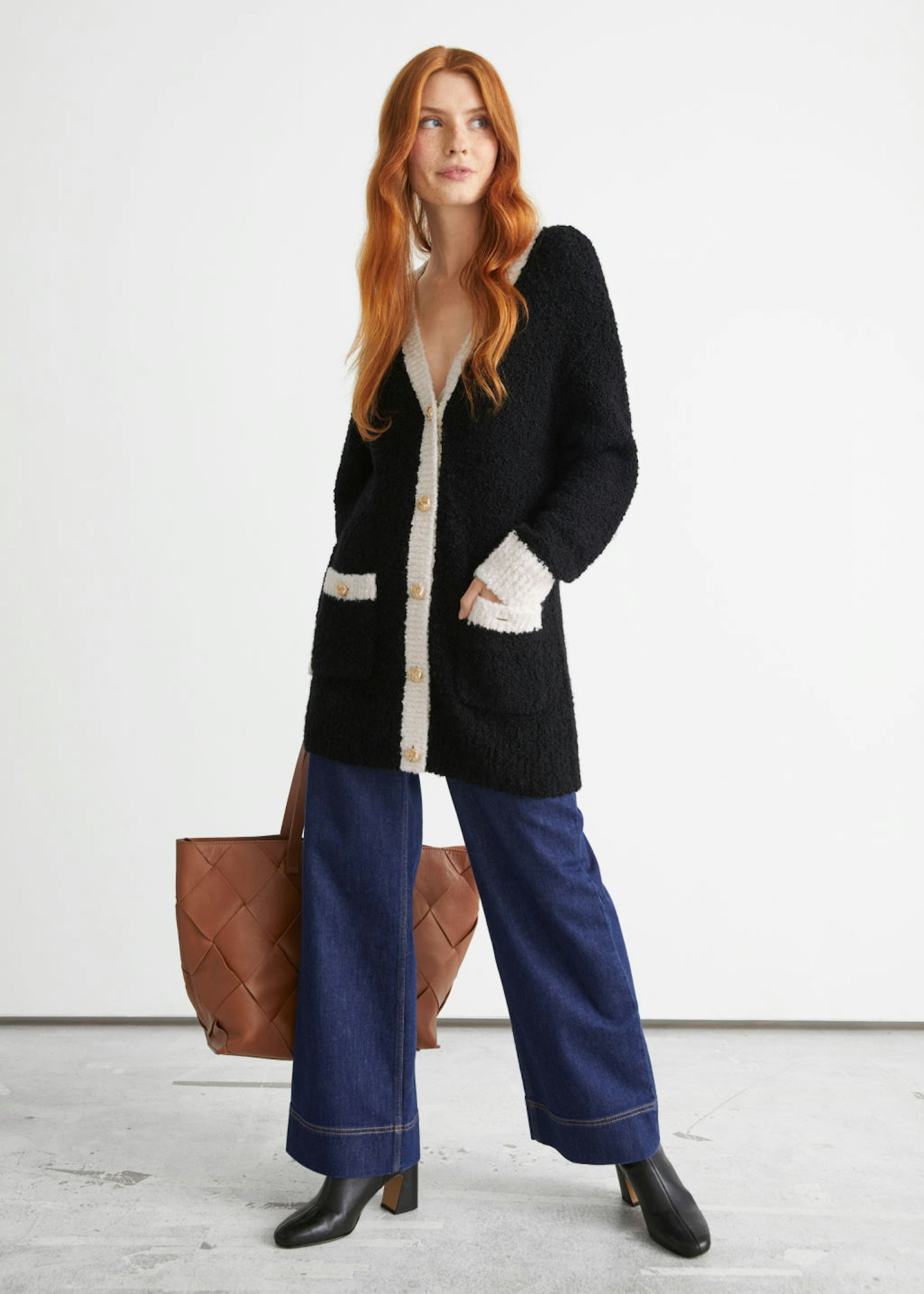 A model wearing a cardigan from & Other Stories