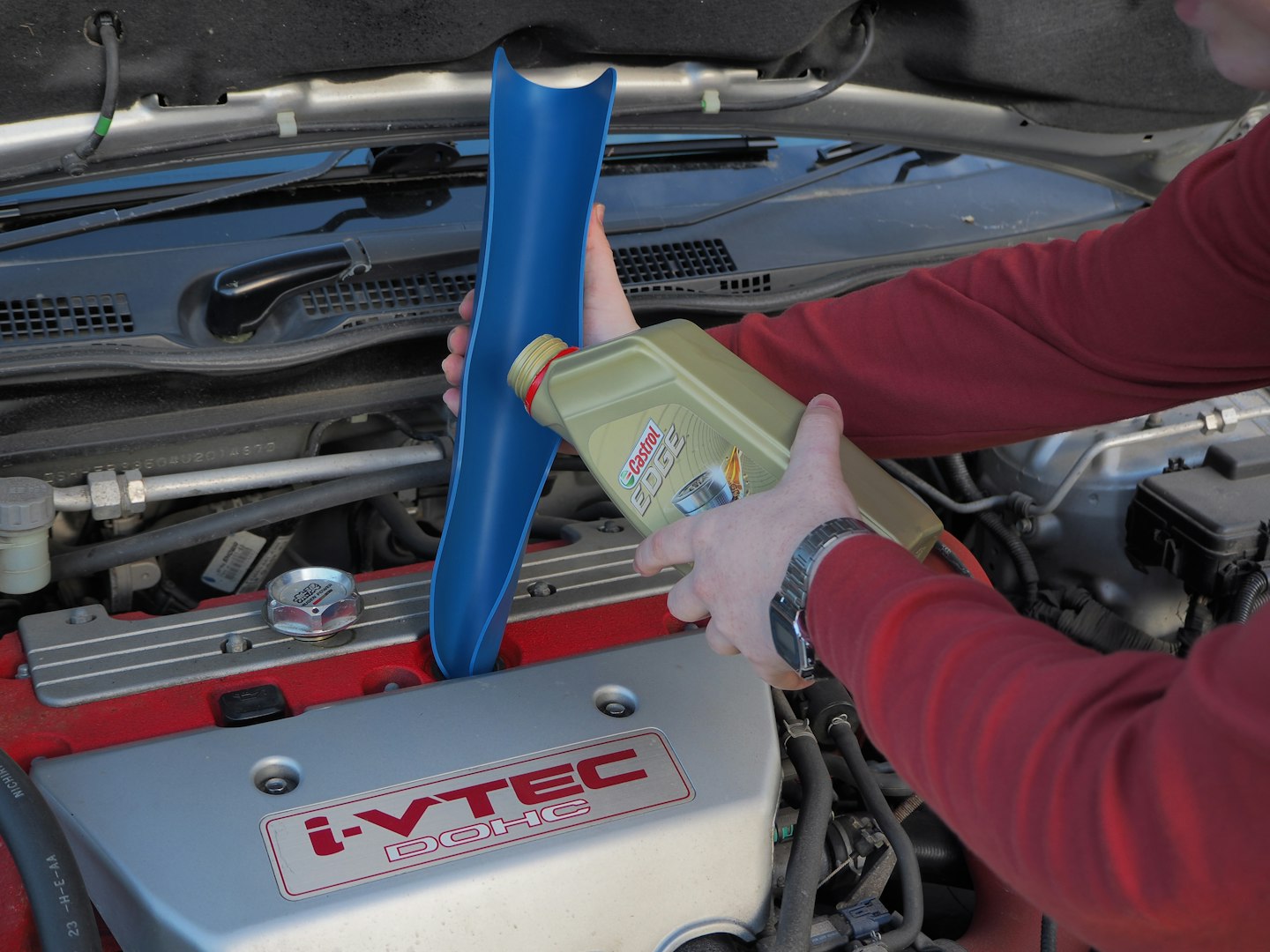 Filling the car's engine oil using the Draper funnel