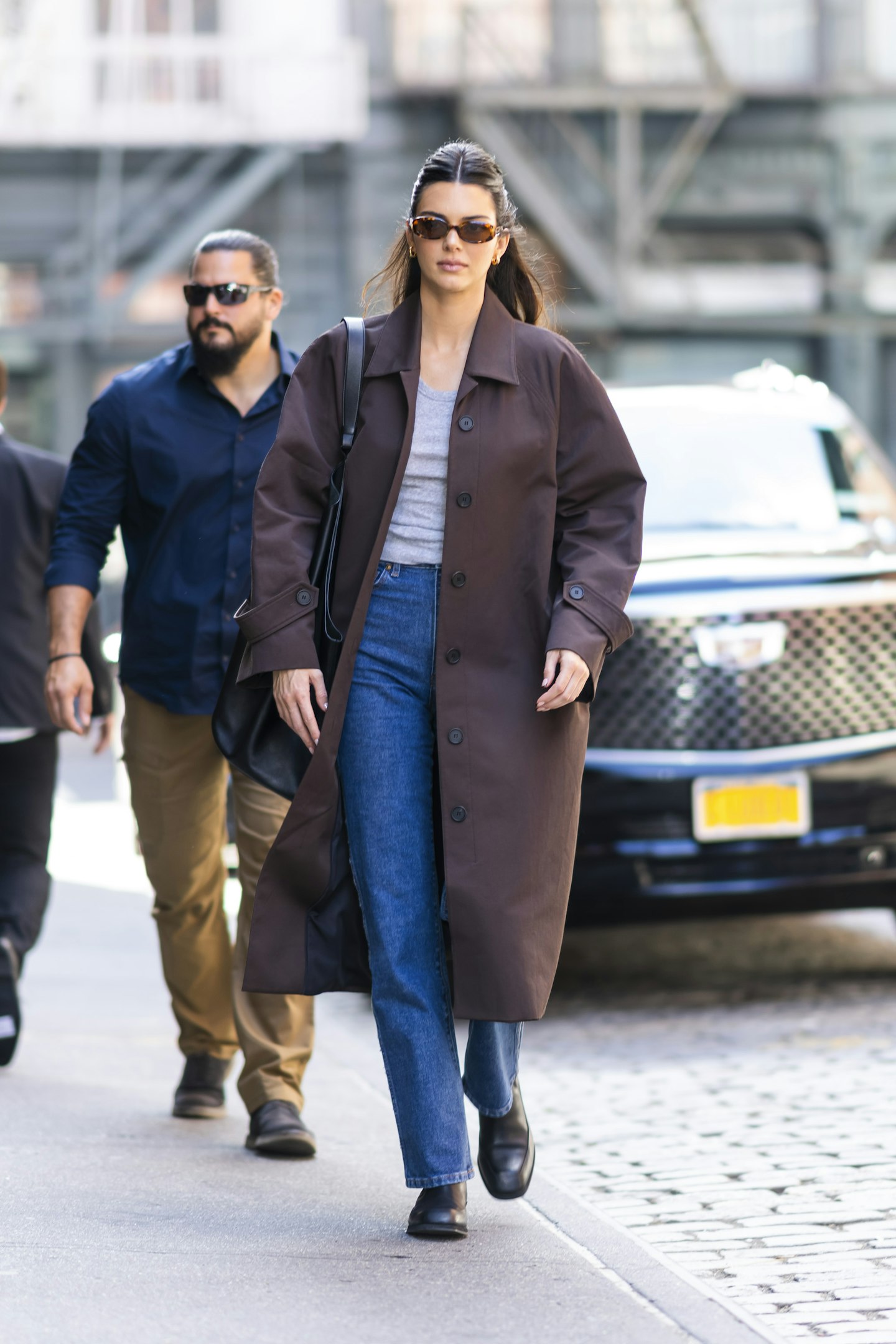 Kendall Jenner wearing a brown overcoat 