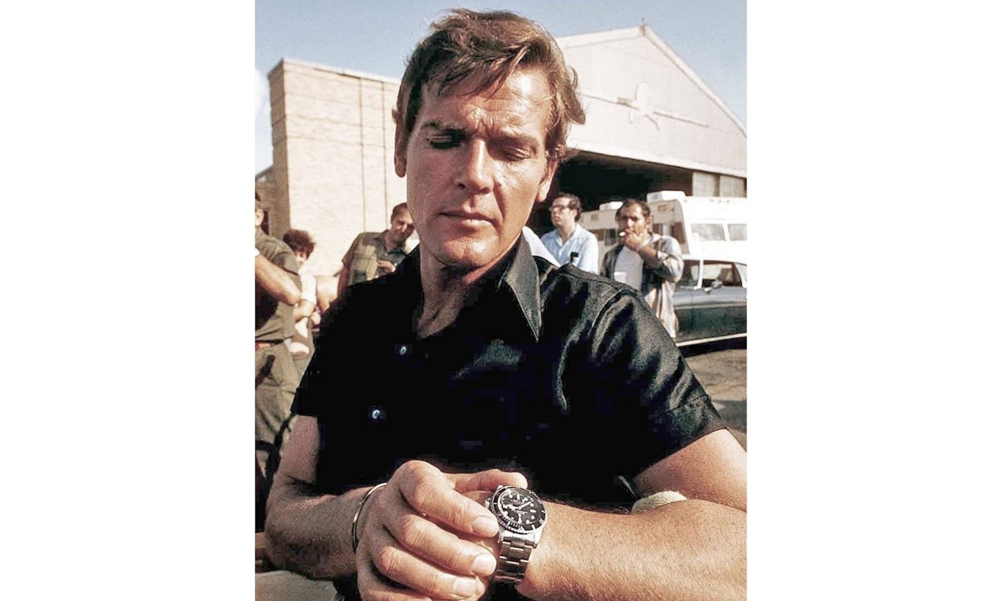 Roger Moore wearing a Rolex 5523 Submariner watch