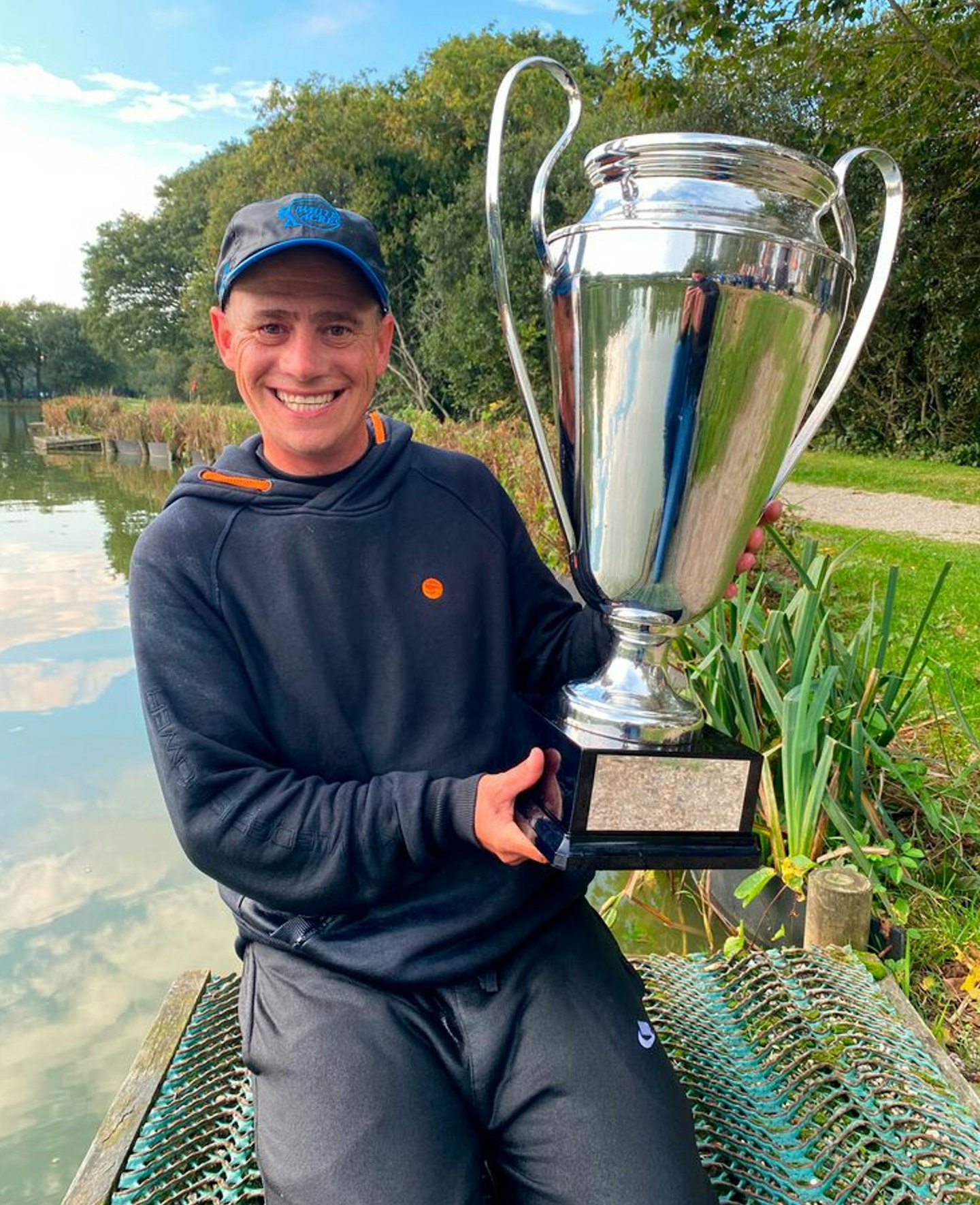 A big smile and an even bigger trophy for Paul