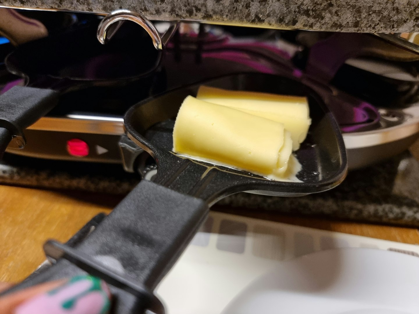 Close up of cheese under raclette grill
