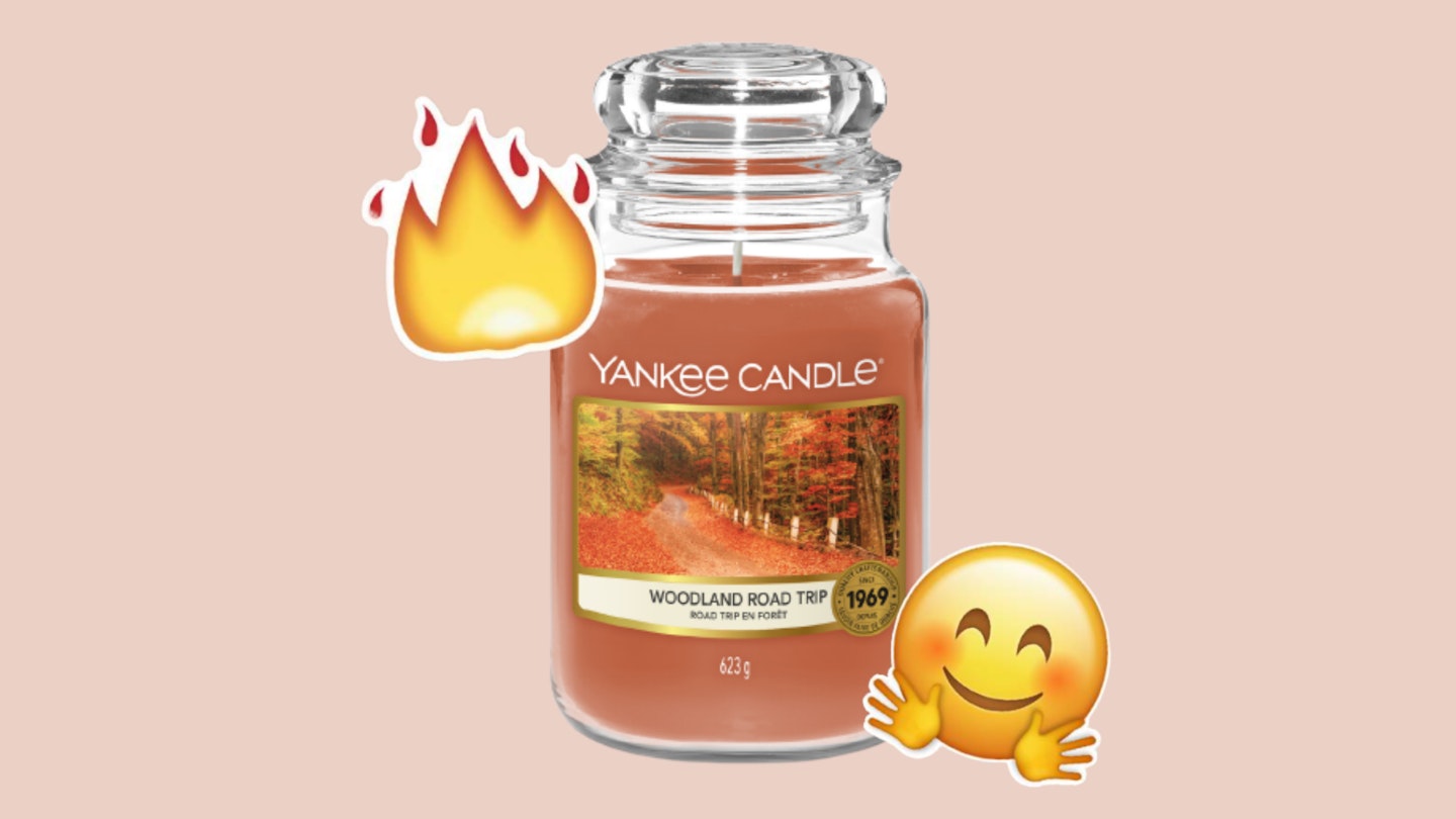 Yankee candle on a muted purple background. 