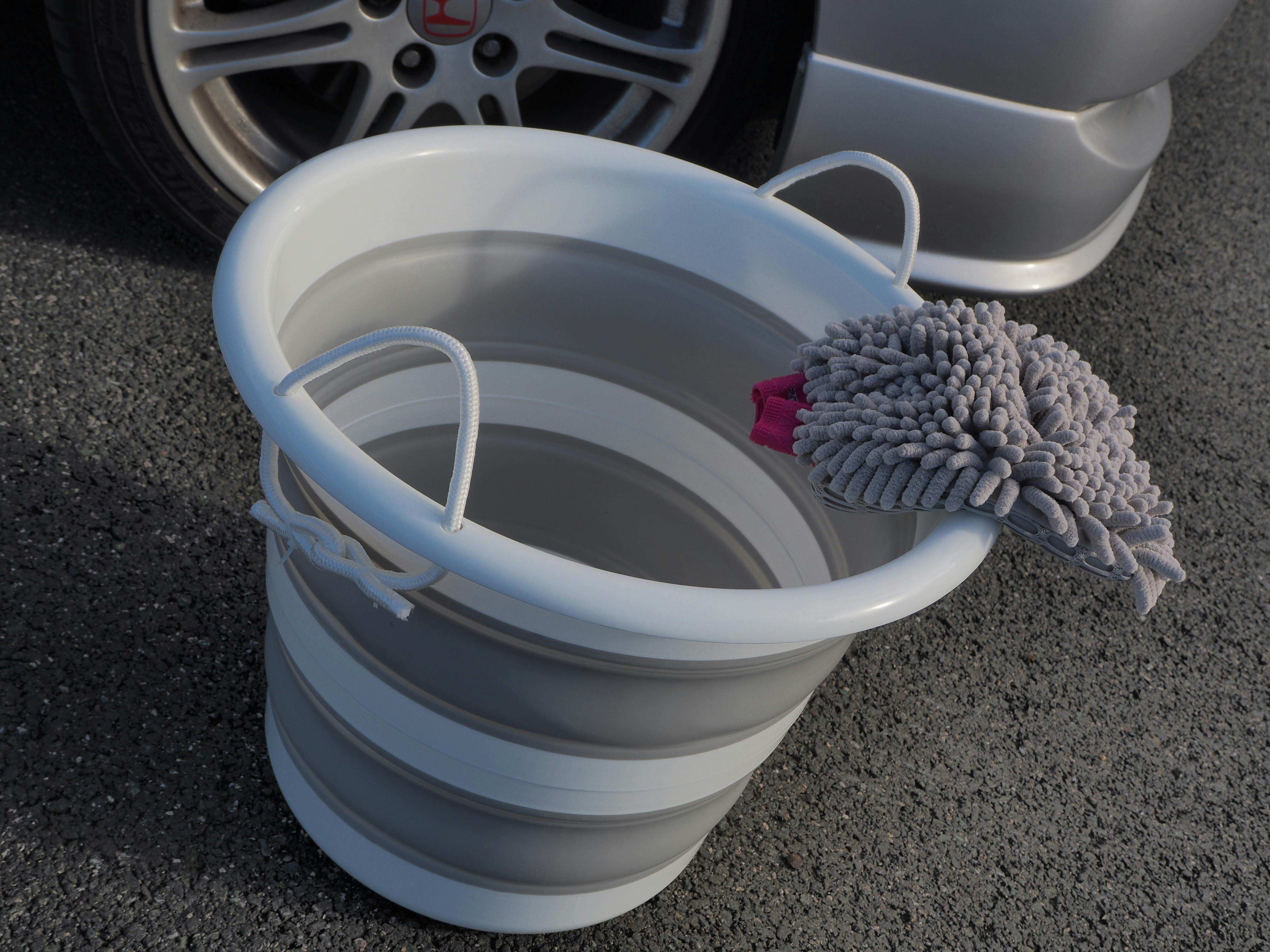 The bucket with a wash mitt next to it