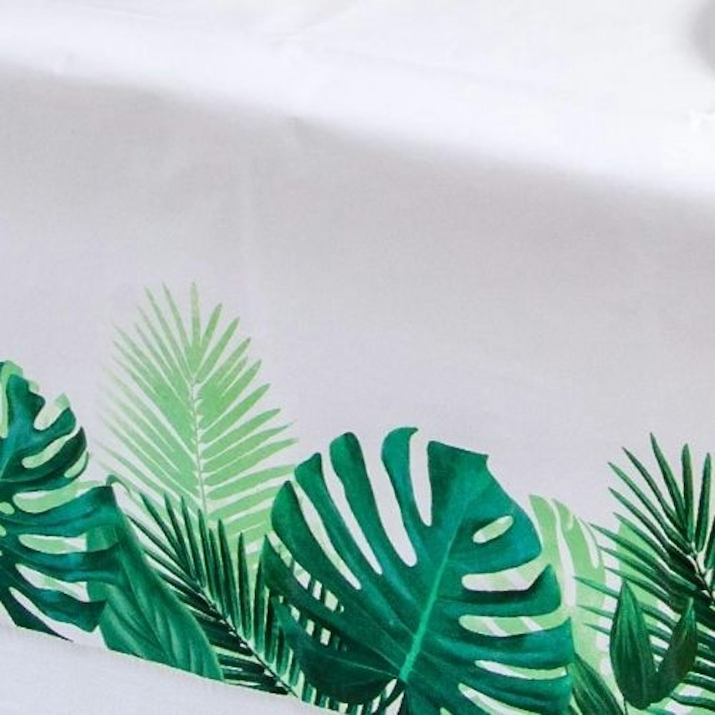 A Tablecloth corner, which is illustrated with palm leaves.