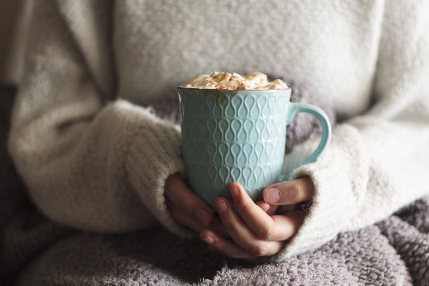 Woman holding hot chocolate