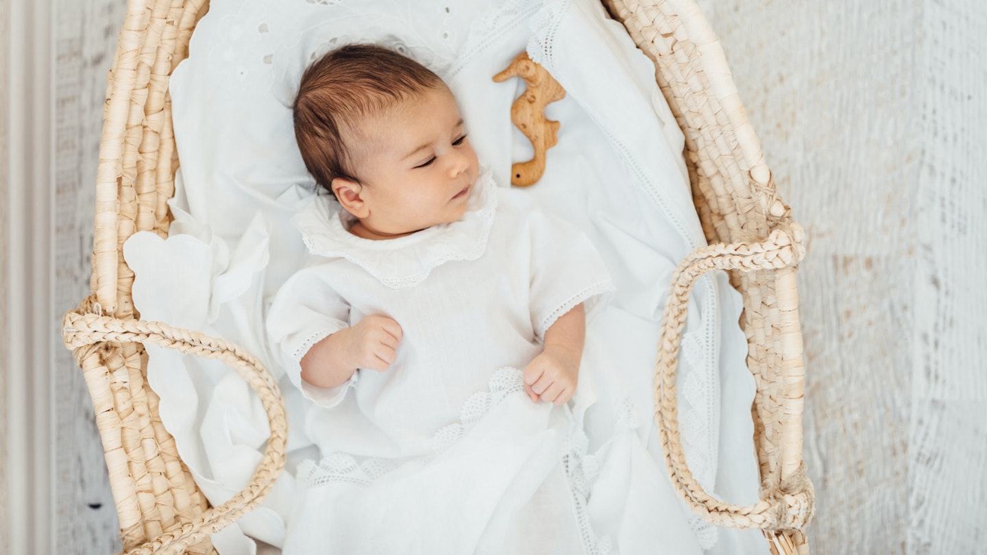 Baby in Moses basket