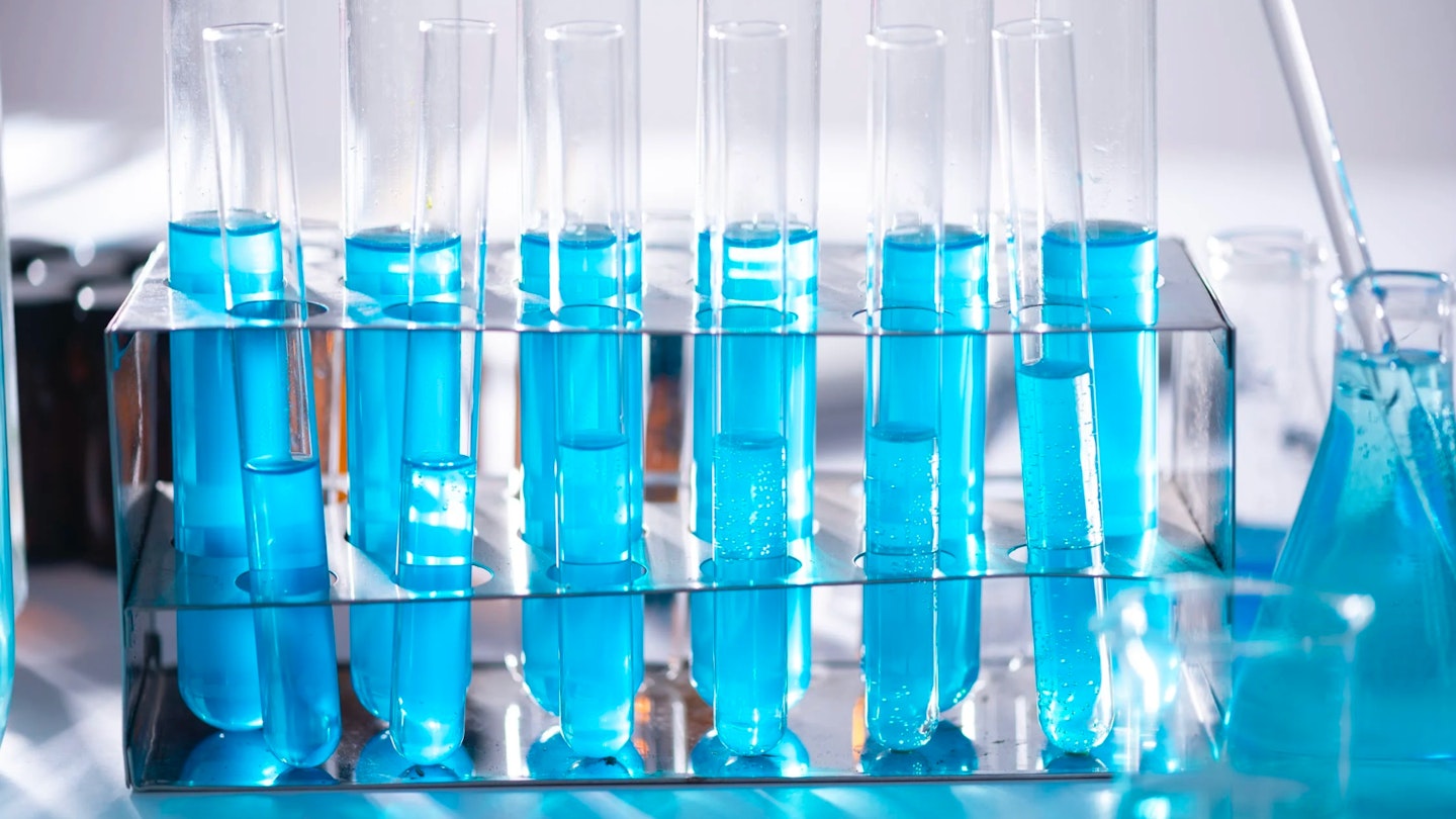 Test tubes with blue liquid in a lab