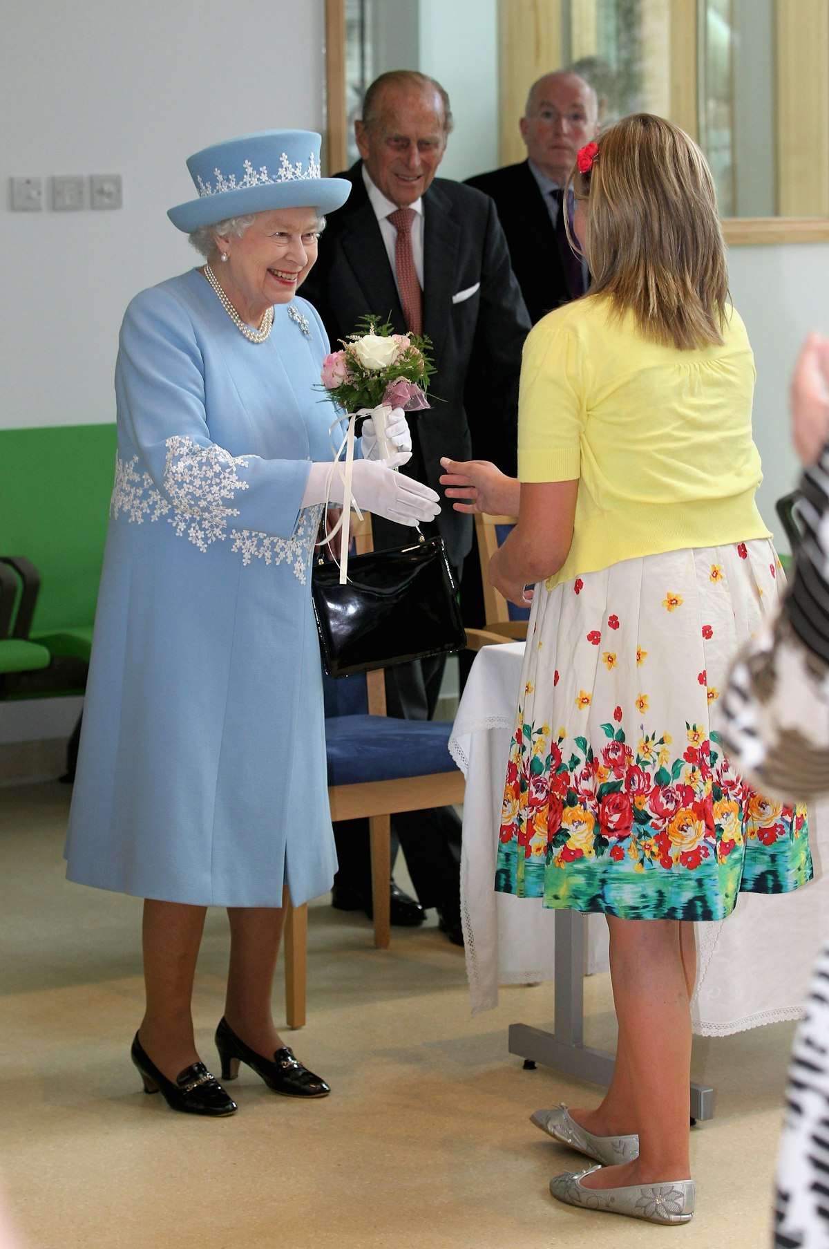Why Does The Queen Always Carry A Handbag?