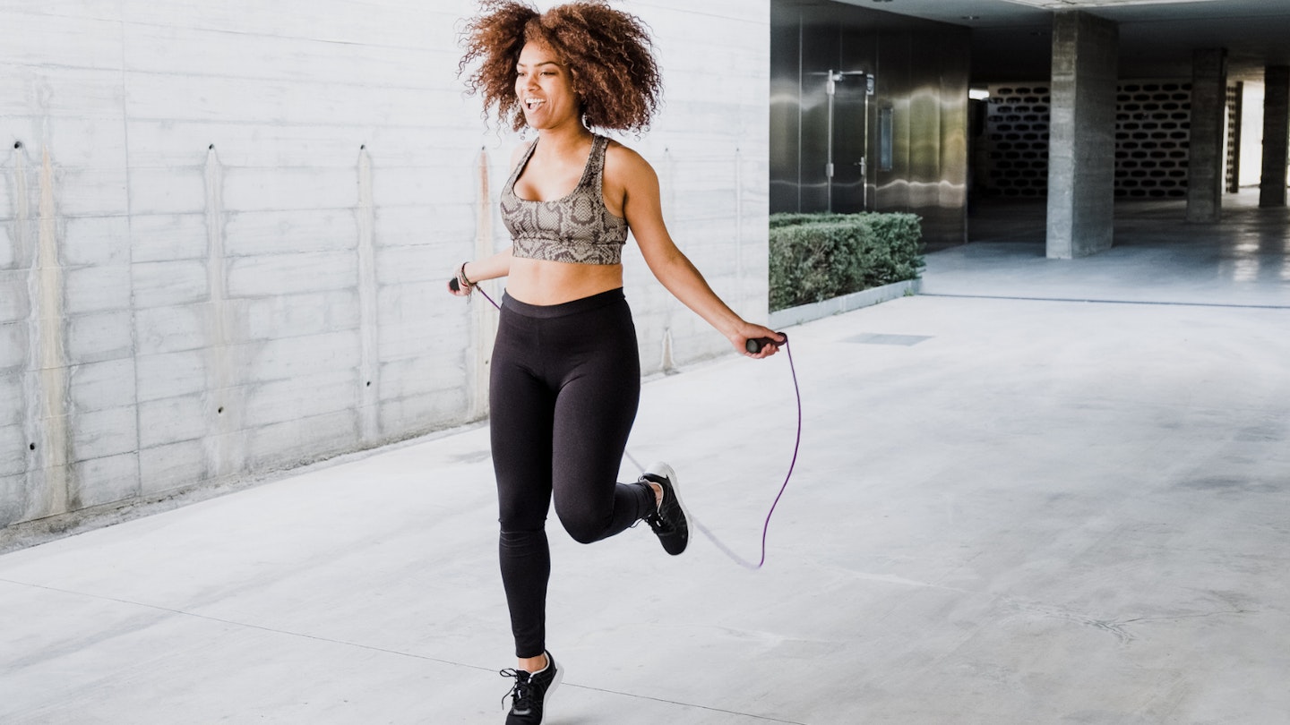 Woman using skipping rope