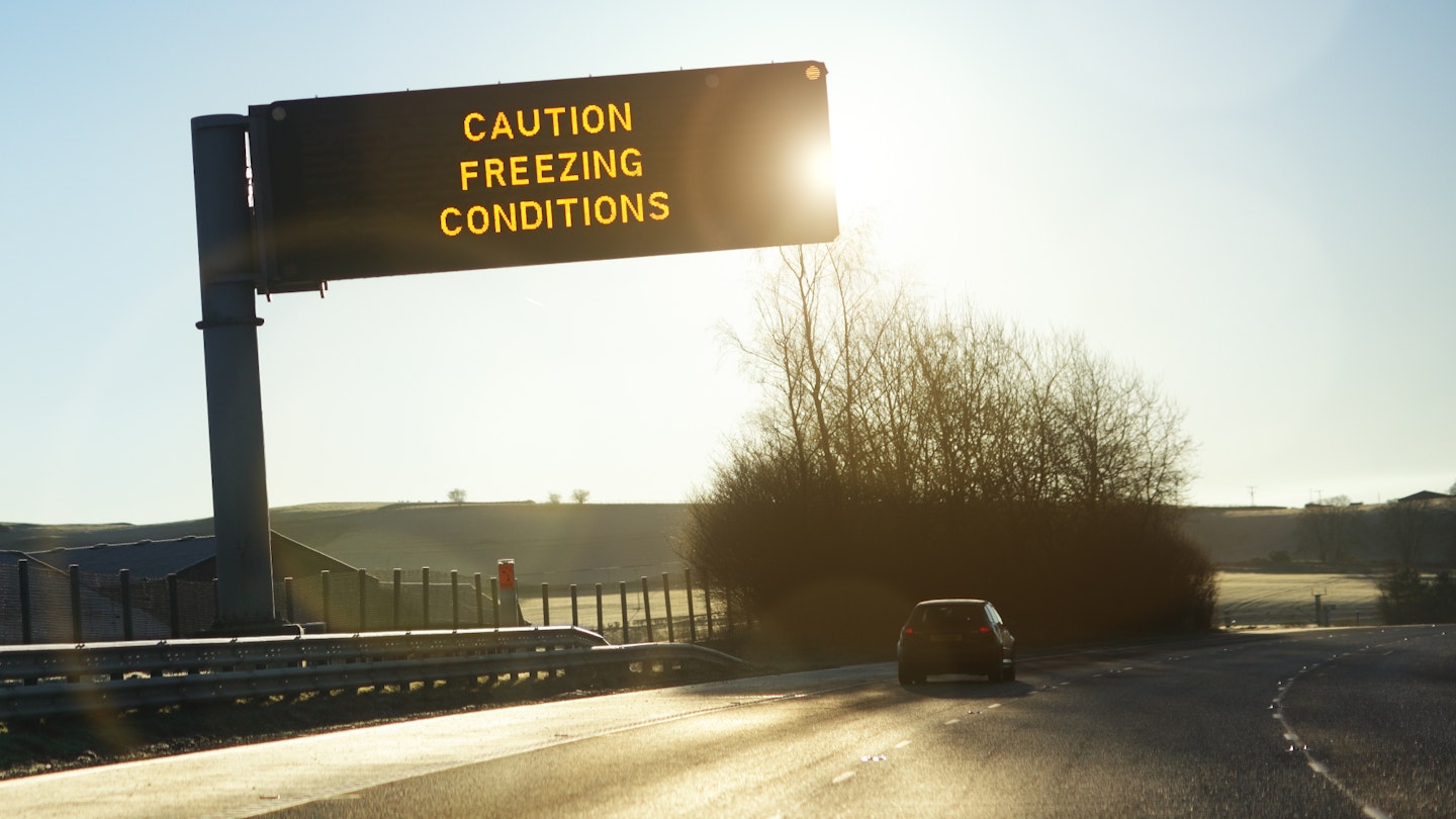Winter caution sign on UK motorway 