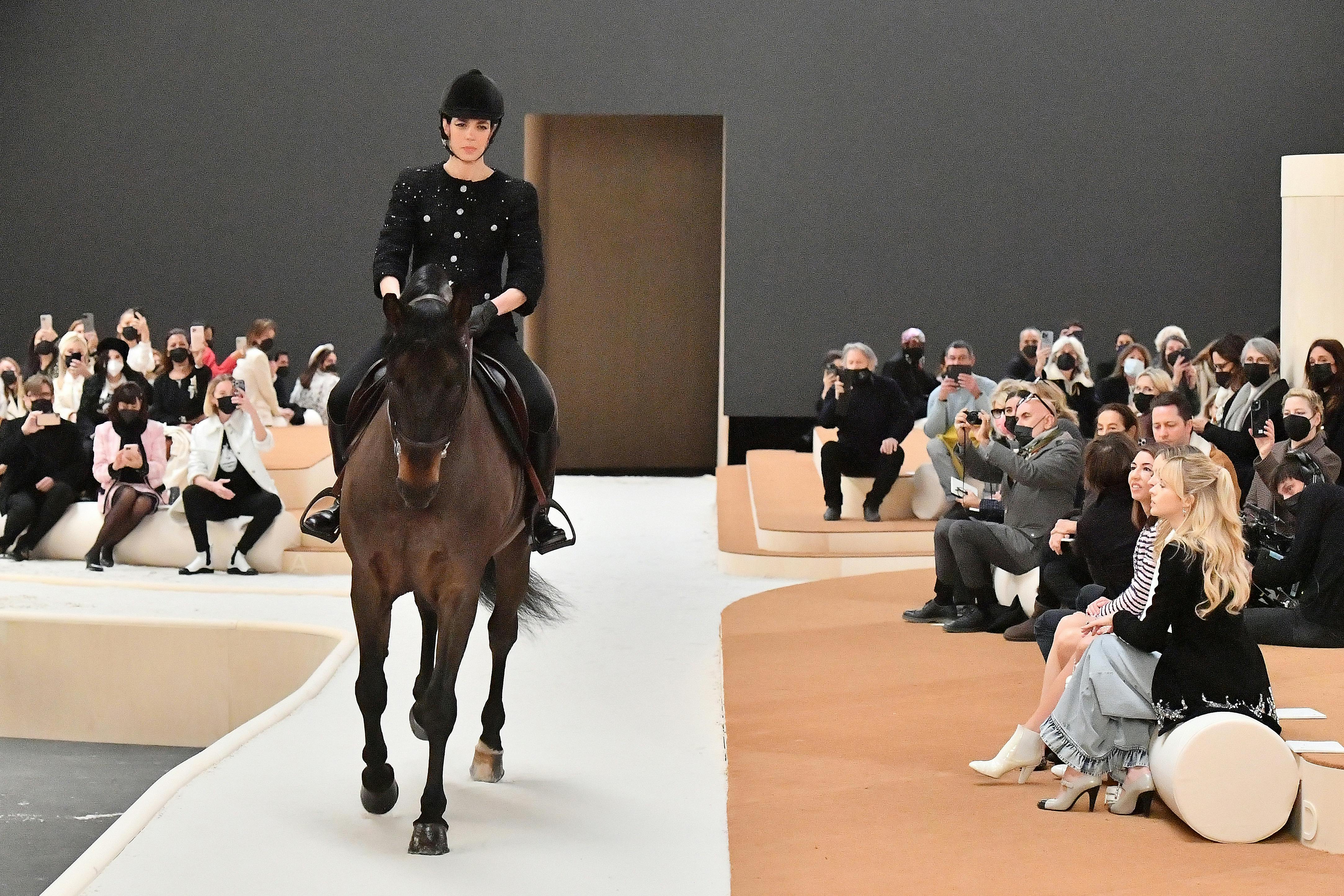 Margot Robbie Leads The FROW At Chanel, Where An Actual Horse