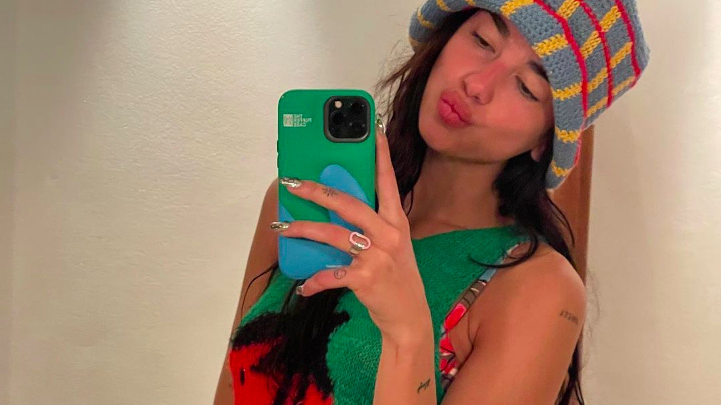 Dua Lipa with a phone case from Urban Sophistication 