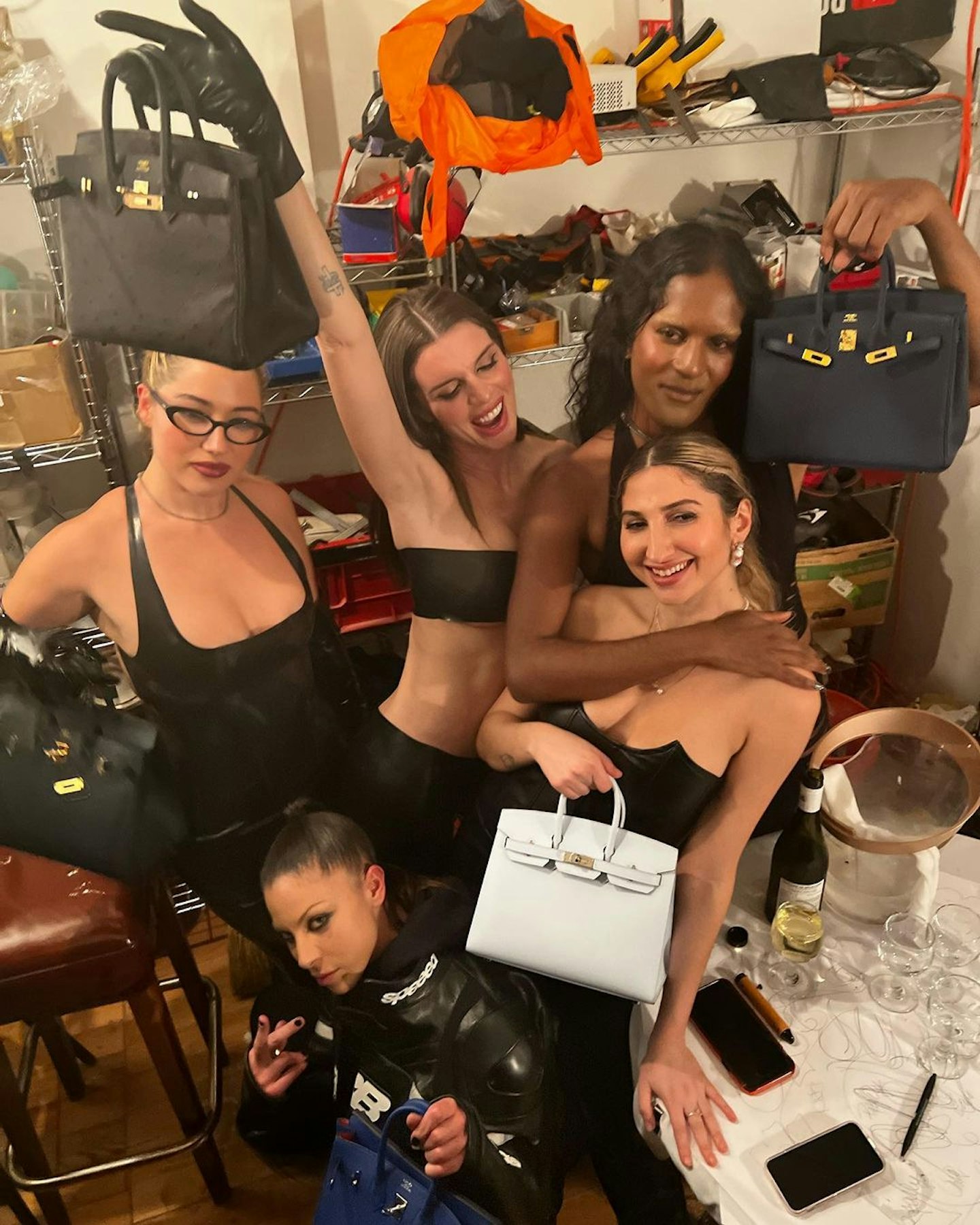 Julia Fox surrounded by friends with Birkins 