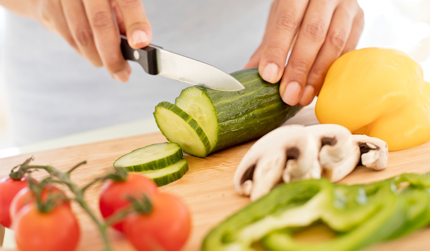 woman cutting veggies
