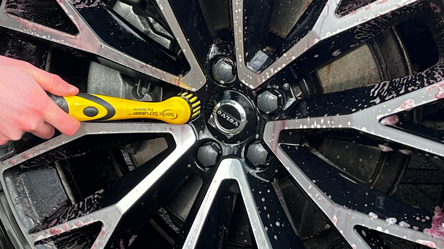 The Sonic Scrubber Pro Detailer being used to clean wheels