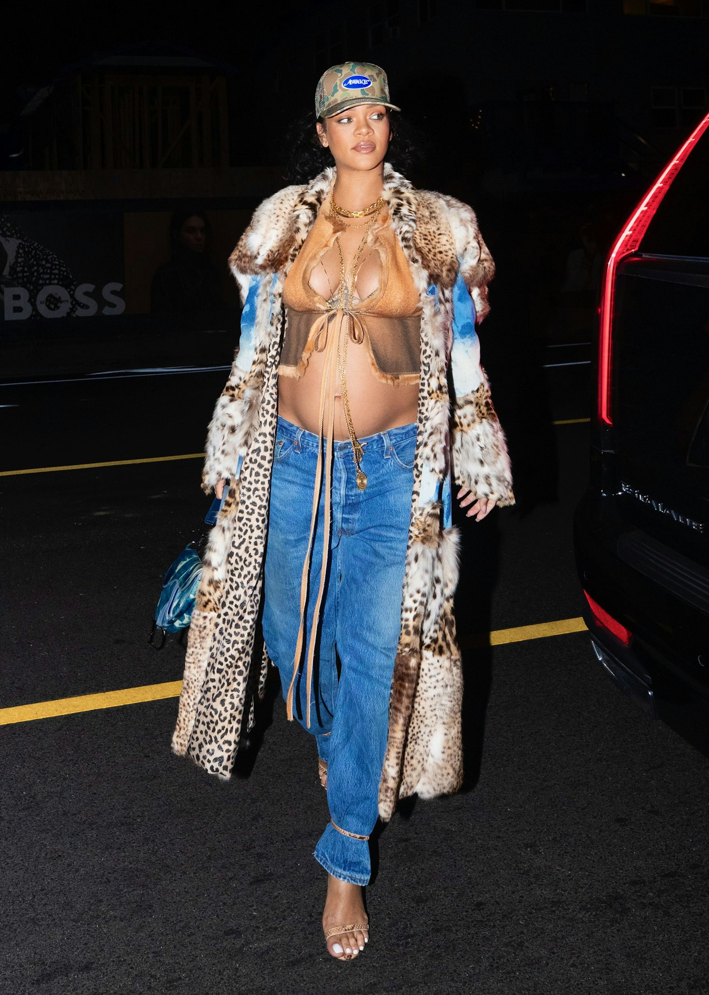 Rihanna wearing a crop top and fur coat 