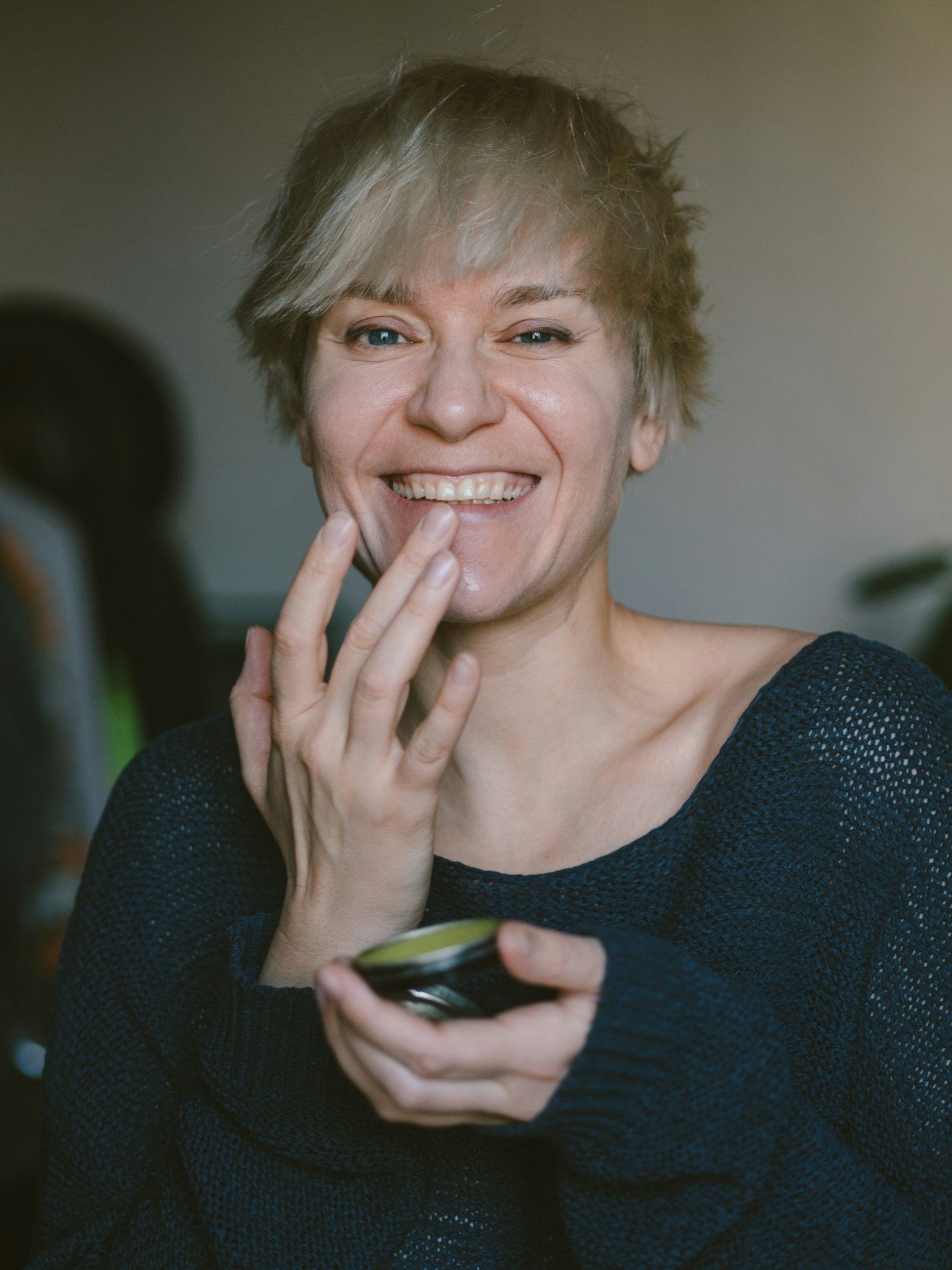 woman applying lip balm