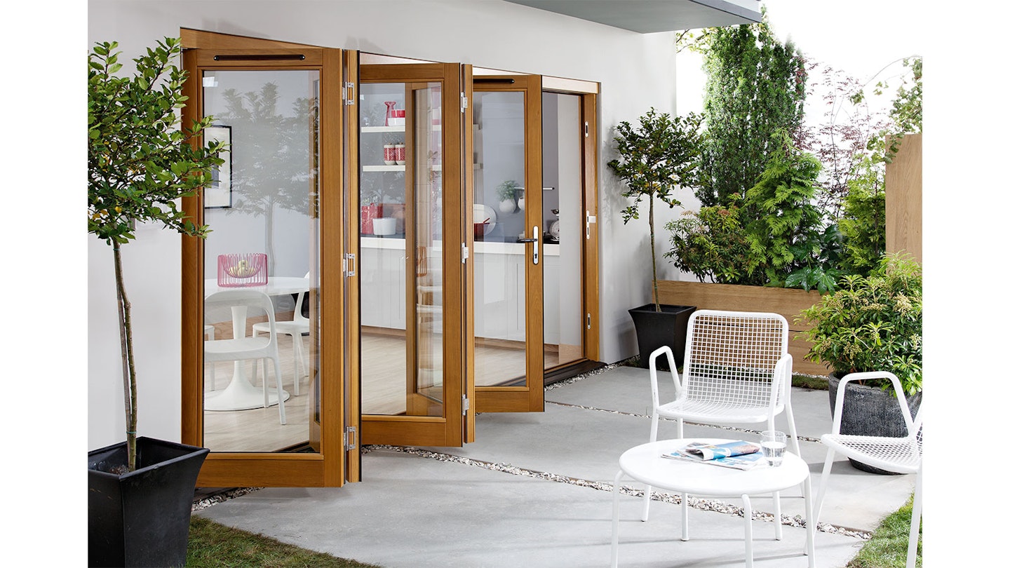 Timber bifold doors opening onto modern patio