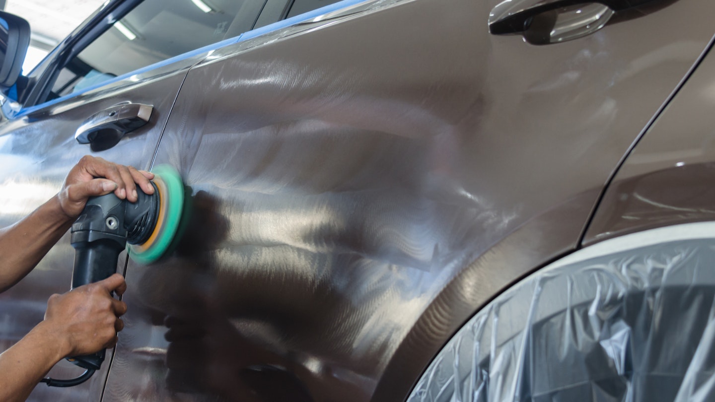 Applying polish to a car body panel using a polishing tool