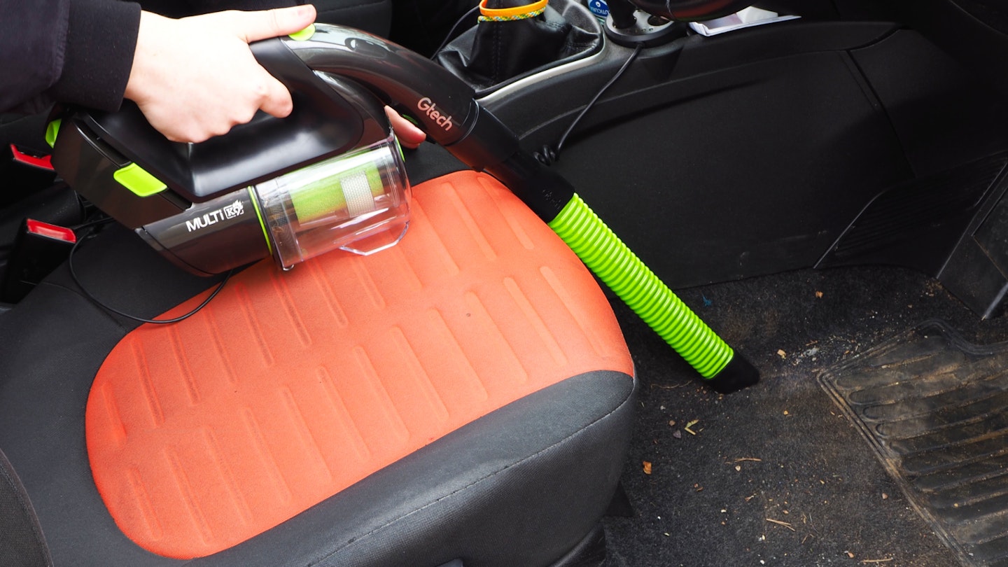 Gtech Multi MK2 K9 cleaning a car footwell
