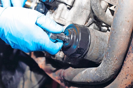 Removing a motorcycle oil filter with a cup wrench
